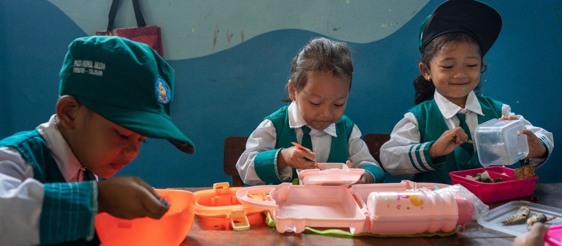 Kids eating at a table Kids eating at a table