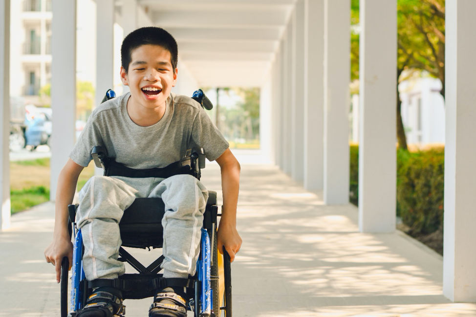 A young boy enjoying a wheelchair-accessible building A young boy enjoying a wheelchair-accessible building